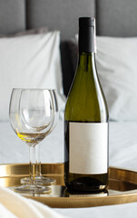 white wine bottle and glass