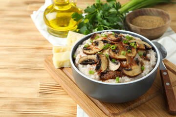 Concept of tasty food with risotto with mushrooms, space for text