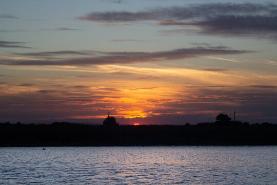 Before sunset with a lake and beautiful vanilla sky © Erik