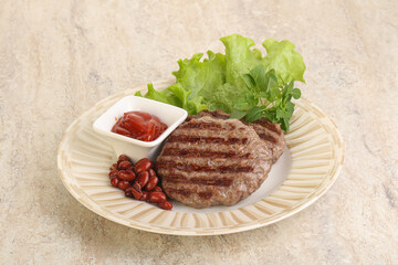 Grilled beef burger cutlet with sauce