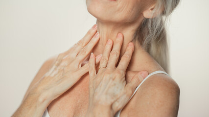 Anonymous Senior Woman Touching Her Neck, Chest, with Hands, Enjoying Soft Skin. Elderly Female...