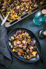 Healthy food - Baked vegetables with Purple Brussels sprouts, broccoli, cauliflower and onions