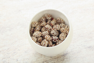 Sweet peanut in sesame seeds