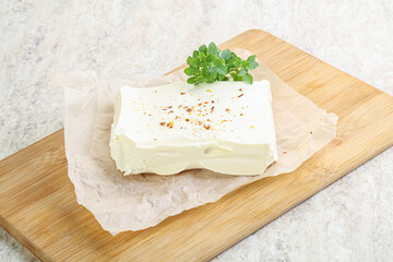 Greek Feta cheese over board