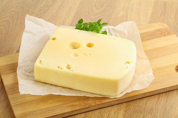 Maasdam cheese over the board