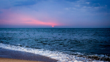 sunrise on the sea in summer on the beach