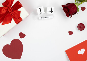 Flat lay February 14: gifts, flowers, cards, candles, hearts on a white background with copy space