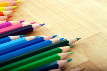 Line of Pencils on Wooden Table