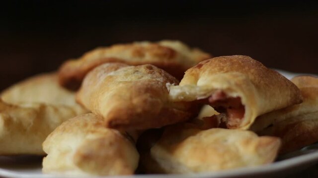 Panzerotti of puff pastry filled with diced quince apples