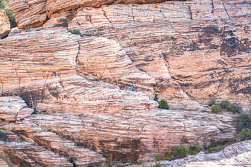 Man Hiking on Red Rocks Just Outside of Las Vegas Nevada in the Dessert