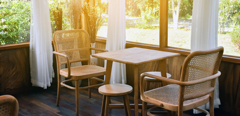 Wooden chairs and wooden table in restroom decoration.