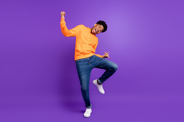 Fototapeta na wymiar Full length photo of young brunette dark skin man dance good mood amazed excited isolated on violet color background