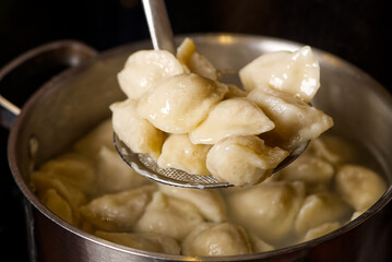 serving dumplings rto plate. Bowl of tasty dumplings served