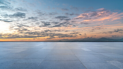 empty tile floor in blue sunny sky