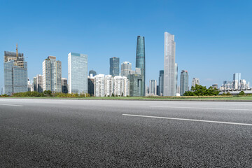 Fototapeta na wymiar Road and Chinese modern city buildings background