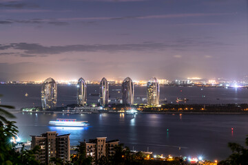 Fototapeta premium Aerial photography of modern city night view of Sanya, China