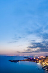 Obraz premium Aerial photography night view of modern city buildings in Qingdao, China