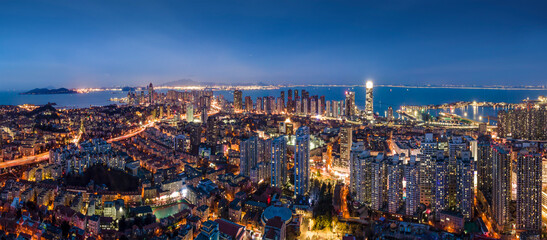Aerial photography night view of modern city buildings in Qingdao, China - obrazy, fototapety, plakaty