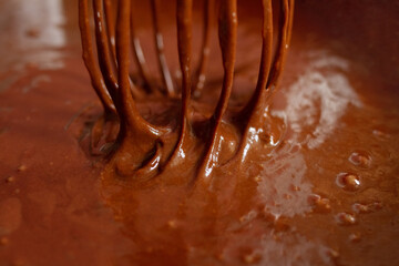 cooking of chocolate cream and hand mixer close-up