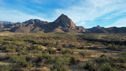Aerial approach to a prominent rock formation near Tucson, Arizona  - Powered by Adobe