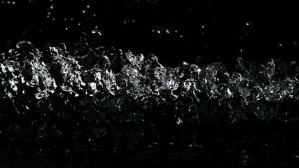 Super slow motion of impact hit of splashing water, close-up. Filmed on high speed cinema camera, 1000 fps.