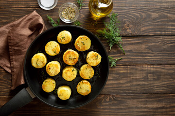 Fondant potatoes in frying pan