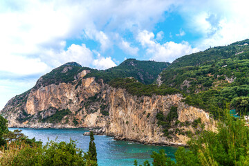 Fototapeta na wymiar Mountains and forestry hills surround resort on Corfu island