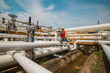 Naklejka premium Male worker inspection at valve of visual check record pipeline oil and gas.