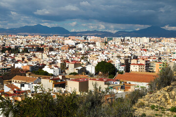 Obraz premium View of the roofs of the buildings of Alicante from the top of the Castillo Santa Barbara