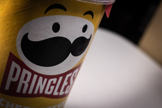 Kumamoto, JAPAN - Sep 3 2021 : Closeup a package of Pringles, an US brand of stackable potato-based crisps (potato chips), on a table.