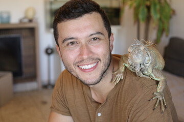 Handsome ethnic man and his spectacular Iguana