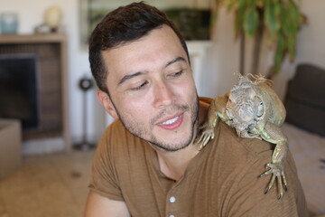 Handsome ethnic man and his spectacular Iguana