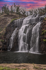 Obraz premium beautiful Australian waterfalls at sunset central australia.