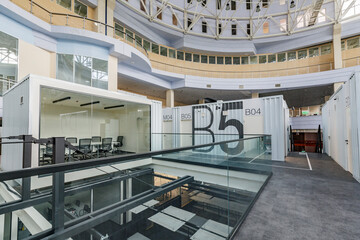 Interior of modern business center with private working rooms