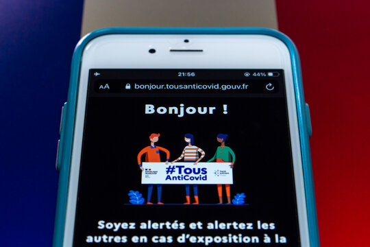 Kumamoto, JAPAN - Oct 20 2021 : TousAntiCovid website on iPhone on French flag. TousAntiCovid is a contact tracing app for monitoring the spread of the COVID-19 pandemic in France.