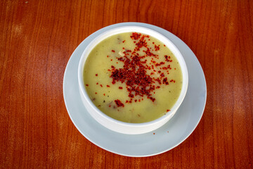 Soup in a bowl with chili powder on it