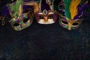 Mardi Gras Mask and colorful Mardi Gras Beads Background © vetre