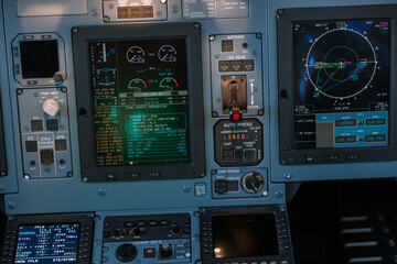 Airplane cockpit with control panel, dashboard and flight displays