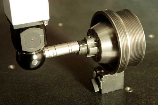 CMM probe measuring on steel cylinder