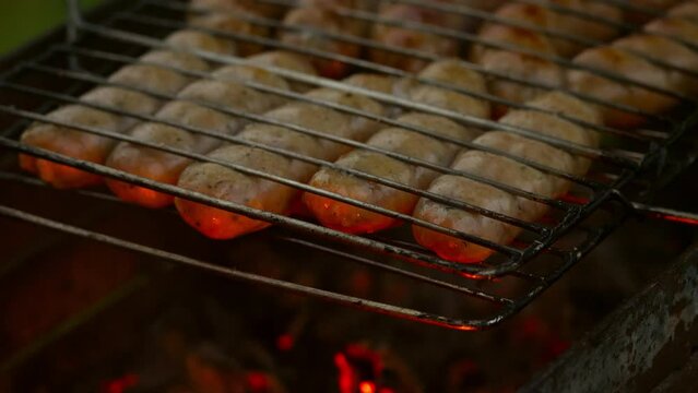 Grilling sausages on the barbecue