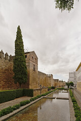 Fototapeta na wymiar Walkways and water pools outside of the old roman city walls of Cordoba, Spain 