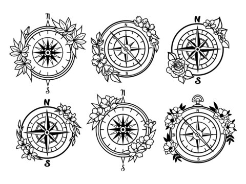 Set of  floral compasses. Collection of stylized compass rose. Nautical. Decorative items for travel with a floral wreath. Vector illustration isolated on white background. Tattoo.