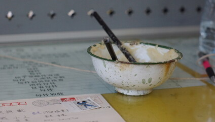 bowl of wheat paste for stamp in the chinese yunnan, liiiang post office