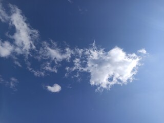Fototapeta na wymiar White Fluffy Cumulus Clouds blue sky look so beautiful 