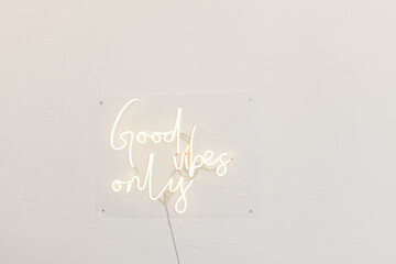 Neon words on the wall. Good vibes only neon sign at the bar, cafe or at home.