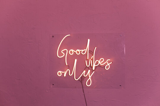 Neon words on the wall. Good vibes only neon sign at the bar, cafe or at home.