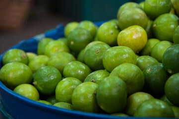 fresh limes in a market