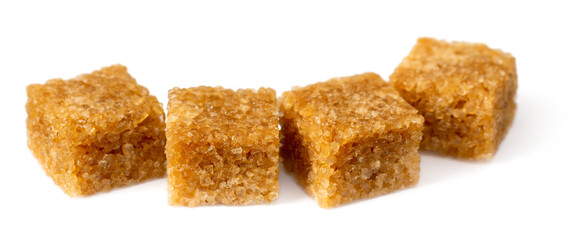 Brown sugar cubes isolated on white background