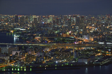 Jungle of skyscrapers at night in Osaka City