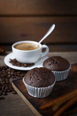 Chocolate cake and a cup of coffee served in the morning.